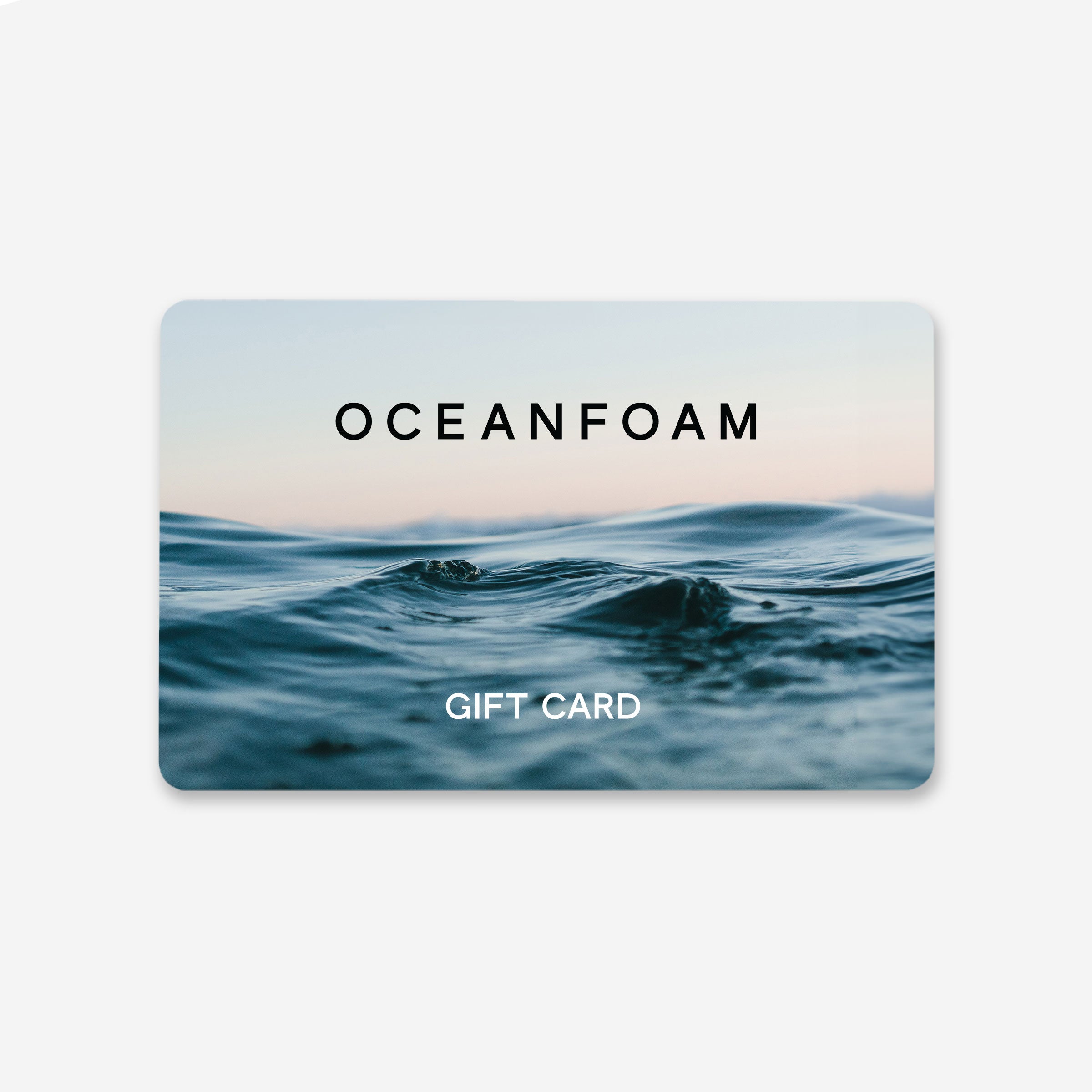Product image for the OceanFoam gift card featuring a gift-card silhouette with ocean waves, OceanFoam logo on the top third in black and "Gift Card" on the bottom third in white